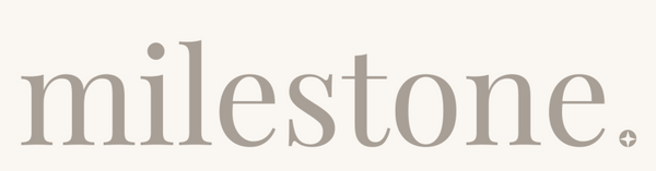 Text 'milestone.' in a simple, elegant font on a light gray background