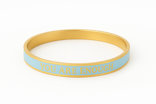 Blue and gold enamel bangle with text 'You are Enough' on a white background